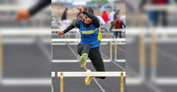 St. Paul Junior Zaya Lewis during one of her hurdling events. Lewis finished 2nd in the 100mH and 1st in the 300mH