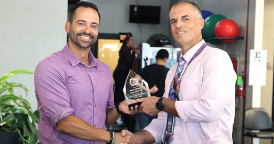 Dr. Matt Hilligas receiving his award from Greg Schlegel, GISH Academy of Medical Sciences & Education Principal 