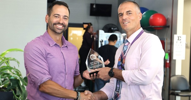 Dr. Matt Hilligas receiving his award from Greg Schlegel, GISH Academy of Medical Sciences & Education Principal 