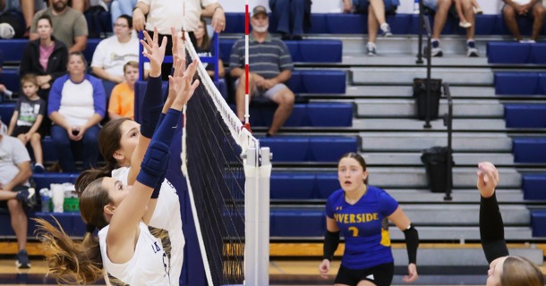 Grand Island Lutheran's Lauren Smith and Ellie Keasling look to block a shot against Riverside Tuesday night at GILH. (Photo by Josh Salmon)
