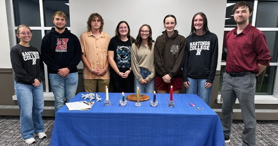 (left to right) Current Alpha Chi Vice President Teyla Huff, new members Cooper Ewoldt, Joel Carter, Jamie Wechsler, Lexi Benson, Ann Bose, Lydia Robertson and current Alpha Chi President Levi West.