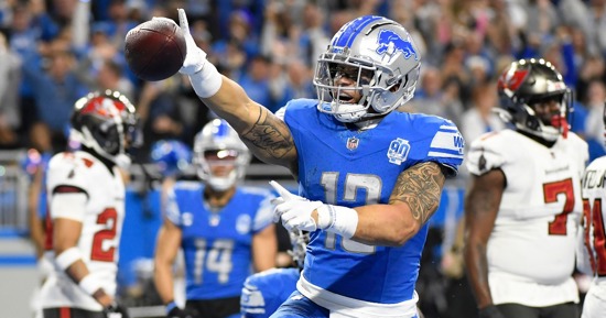 Detroit Lions wide receiver Josh Reynolds (8) celebrates with teammates Jameson Williams (9) and Jared Goff (16) after scoring a touchdown against the Tampa Bay Buccaneers during the first half of an 