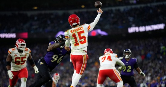 Kansas City Chiefs quarterback Patrick Mahomes (15) passes under pressure from Baltimore Ravens defensive tackle Broderick Washington (96) during the second half of the AFC Championship NFL football game, Sunday, Jan. 28, 2024, in Baltimore. (AP Photo/Matt Slocum)